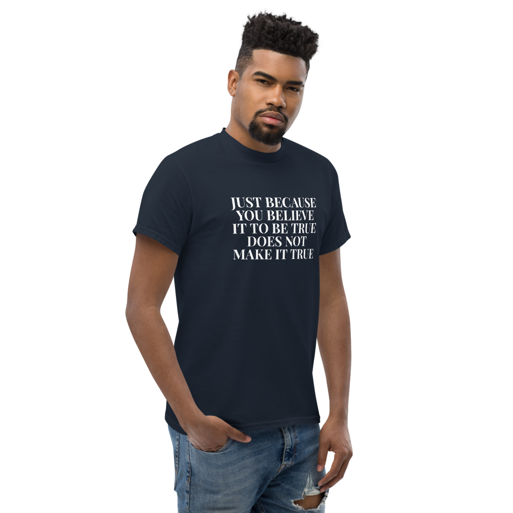 "Just because you believe it to be true does not make it true" printed on a navy unisex classic tee worn by a male