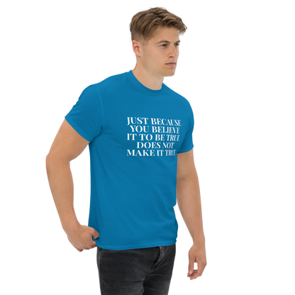 "Just because you believe it to be true does not make it true" printed on a sapphire unisex classic tee worn by a male
