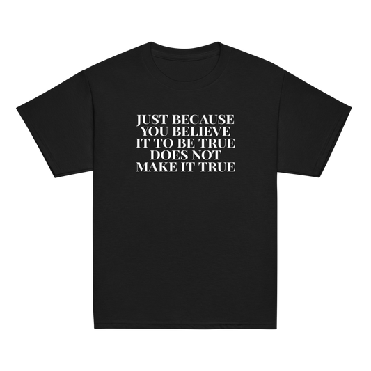 "Just because you believe it to be true does not make it true" printed on a black youth classic tee laying on a flat surface