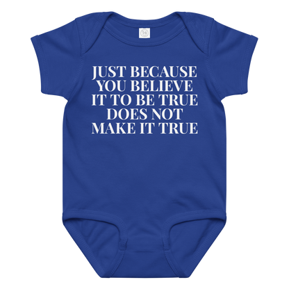 "Just because you believe it to be true does not make it true" printed on a royal baby jersey bodysuit laying on a flat surface amongst other clothes