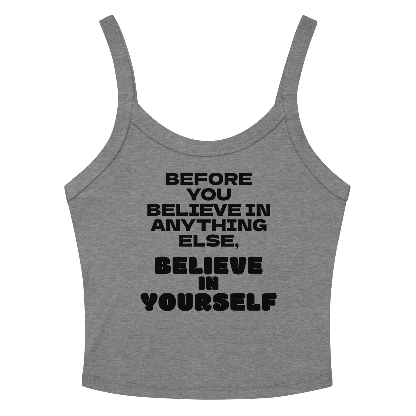 "Before you believe in anything else, believe in yourself" printed on a athletic heather women's micro-rib tanktop laying on a flat surface amongst sunglasses and shorts