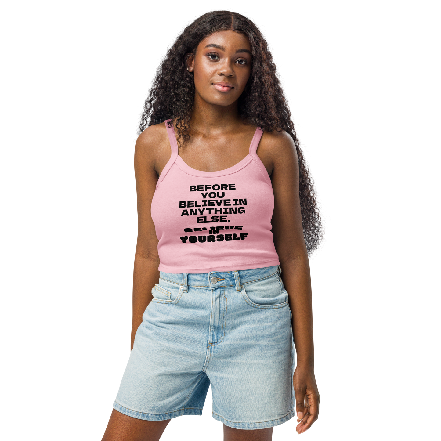 "Before you believe in anything else, believe in yourself" printed on a solid pink blend women's micro-rib tanktop worn by a female