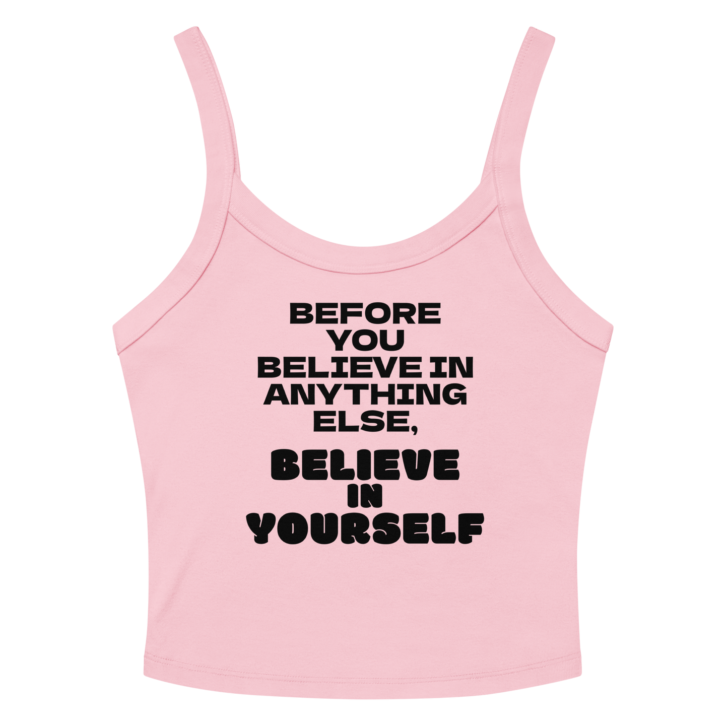 "Before you believe in anything else, believe in yourself" printed on a solid pink blend women's micro-rib tanktop laying on a flat surface amongst sunglasses and shorts