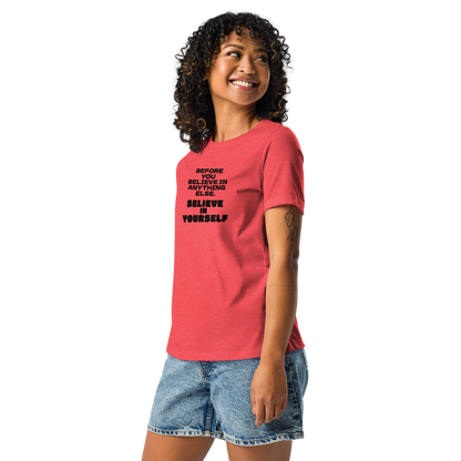 "Before you believe in anything else, believe in yourself" printed on a heather red women's relaxed t-shirt worn by a female