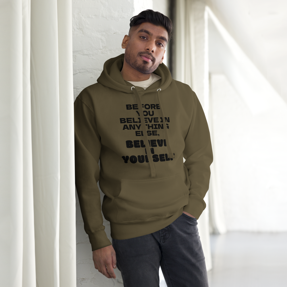 "Before you believe in anything else, believe in yourself" printed on a military green unisex hoodie worn by a male
