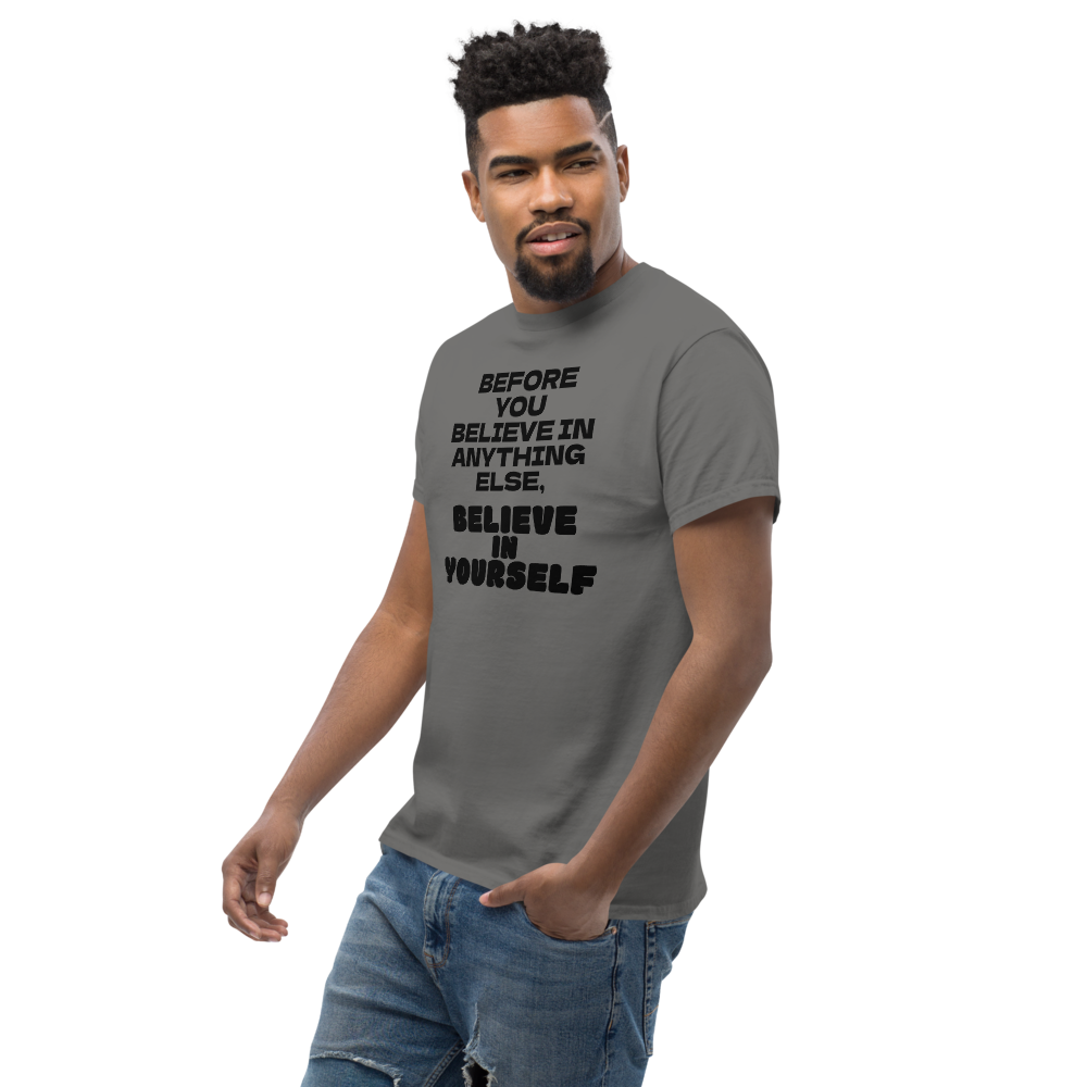 "Before you believe in anything else, believe in yourself" printed on a charcoal unisex classic tee worn by a male