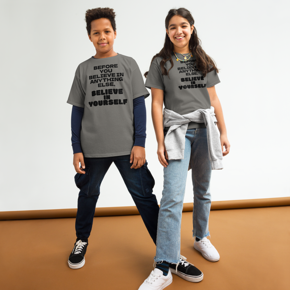 "Before you believe in anything else, believe in yourself" printed on a charcoal youth classic tee worn by a female and male