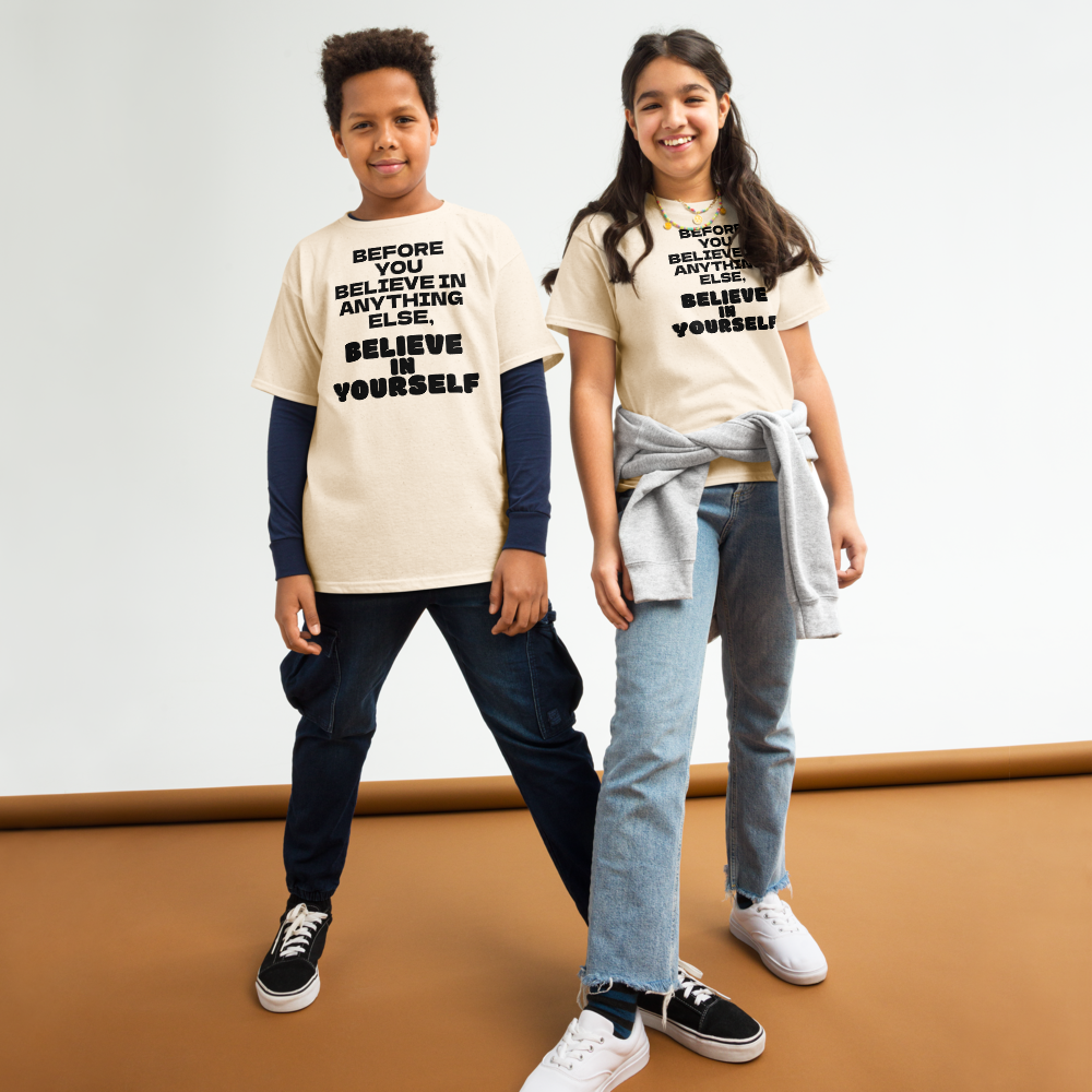 "Before you believe in anything else, believe in yourself" printed on a natural youth classic tee worn by a female and male