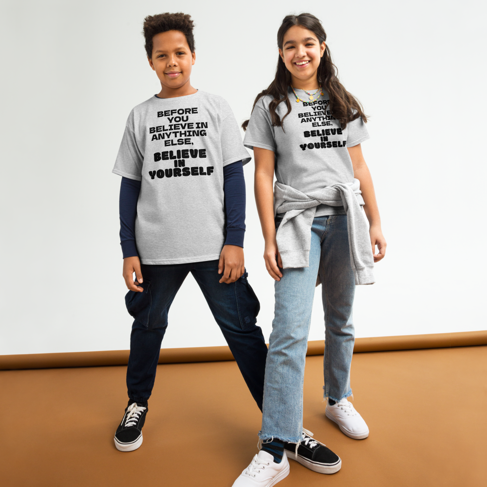 "Before you believe in anything else, believe in yourself" printed on a sport grey youth classic tee worn by a female and male