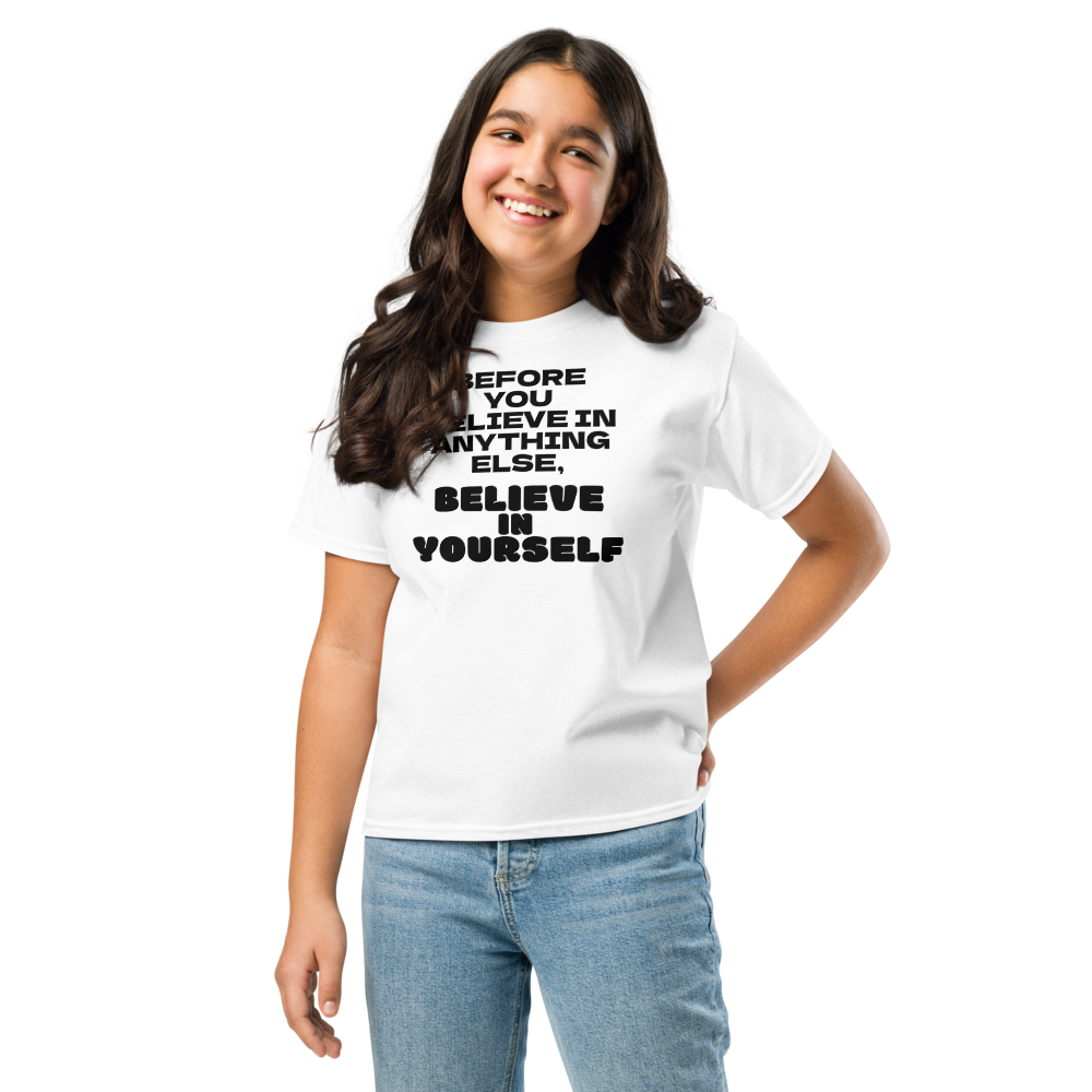 "Before you believe in anything else, believe in yourself" printed on a white youth classic tee worn by a female