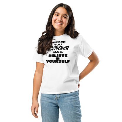 "Before you believe in anything else, believe in yourself" printed on a white youth classic tee worn by a female