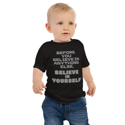 "Before you believe in anything else, believe in yourself" printed on a black baby jersey short sleeve tee worn by a male