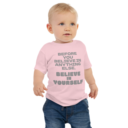 "Before you believe in anything else, believe in yourself" printed on a pink baby jersey short sleeve tee worn by a male