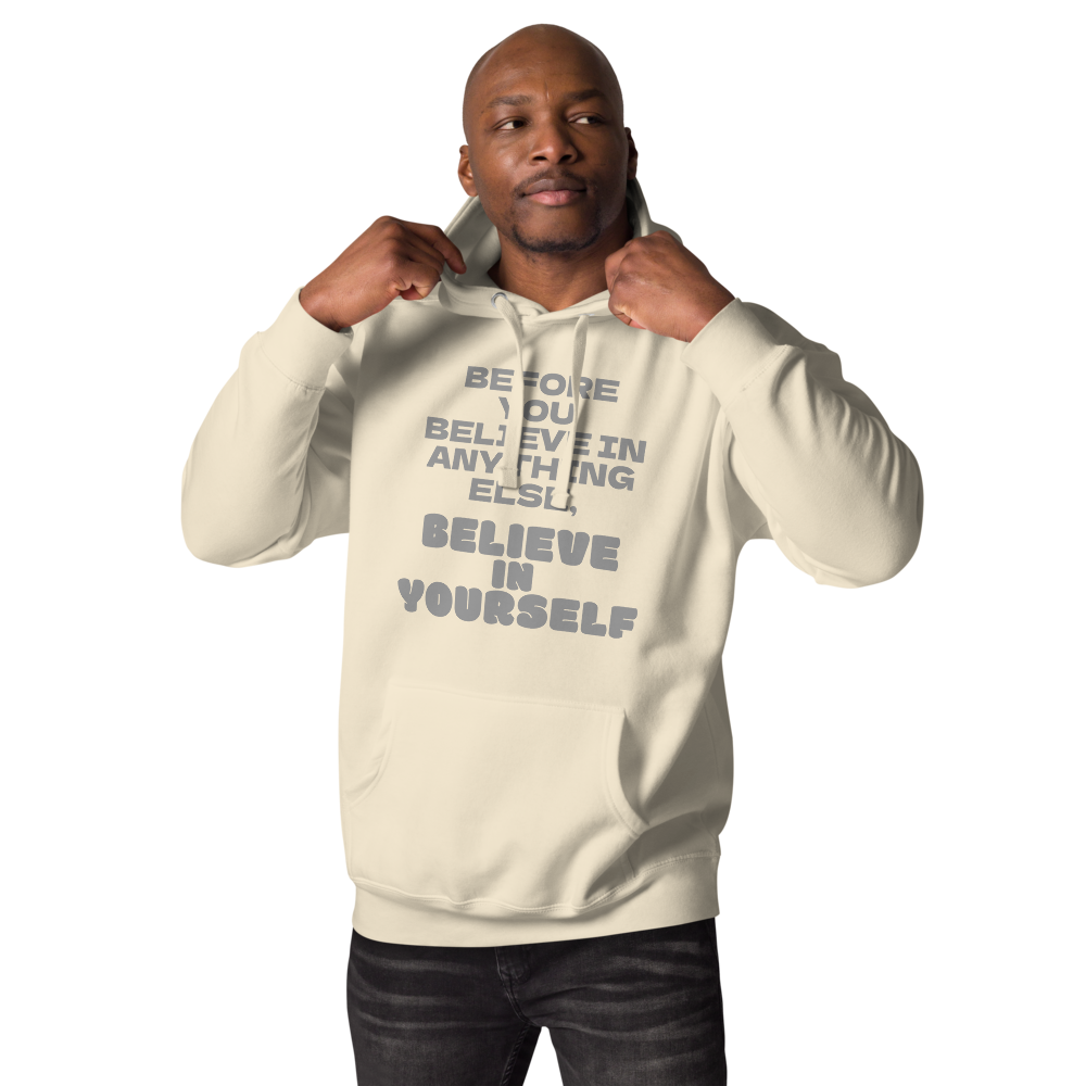 "Before you believe in anything else, believe in yourself" printed on a bone unisex hoodie worn by a male