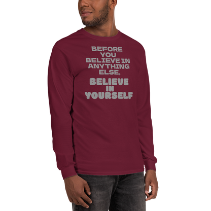"Before you believe in anything else, believe in yourself" printed on a maroon men's long sleeve shirt worn by a male