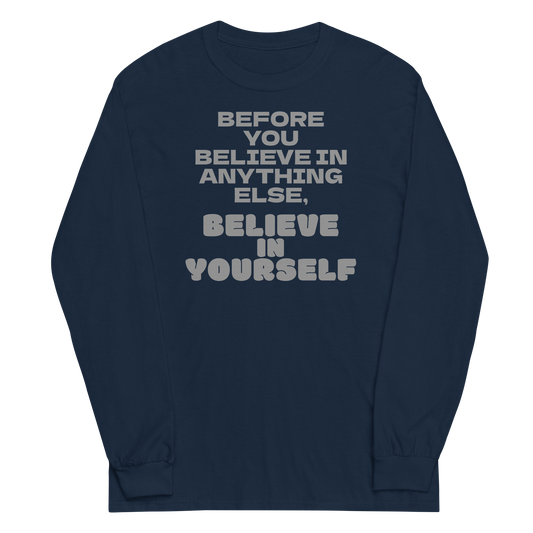 "Before you believe in anything else, believe in yourself" printed on a navy men's long sleeve shirt laying on a flat surface
