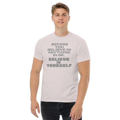 "Before you believe in anything else, believe in yourself" printed on a ice grey unisex classic tee worn by a male