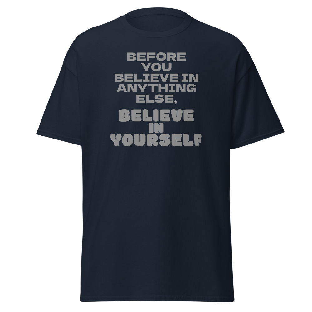 "Before you believe in anything else, believe in yourself" printed on a navy unisex classic tee laying on a flat surface