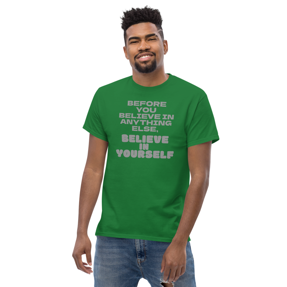 "Before you believe in anything else, believe in yourself" printed on a turf green unisex classic tee worn by a male
