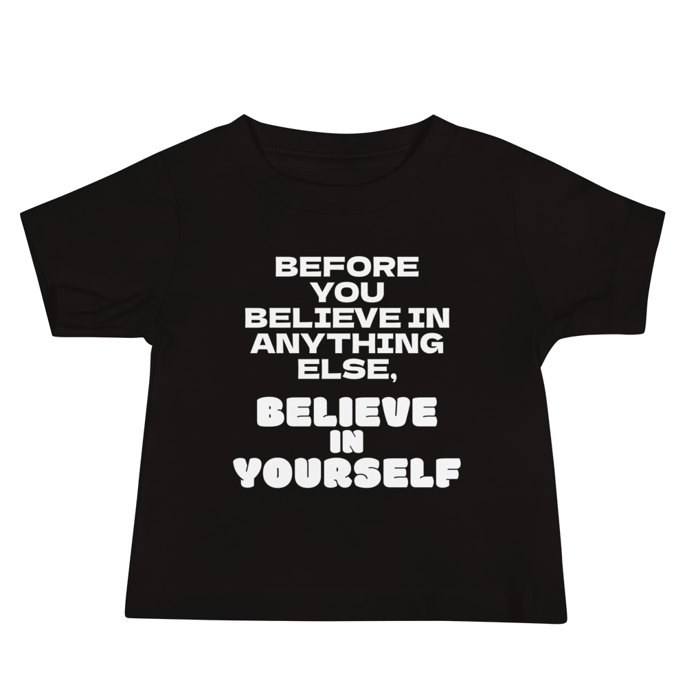 "Before you believe in anything else, believe in yourself" printed on a black baby jersey short sleeve tee laying on a flat surface