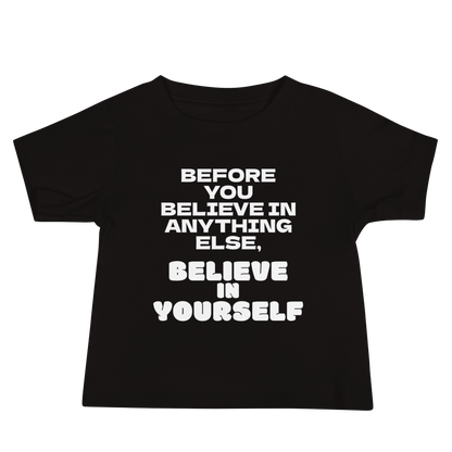 "Before you believe in anything else, believe in yourself" printed on a black baby jersey short sleeve tee laying on a flat surface