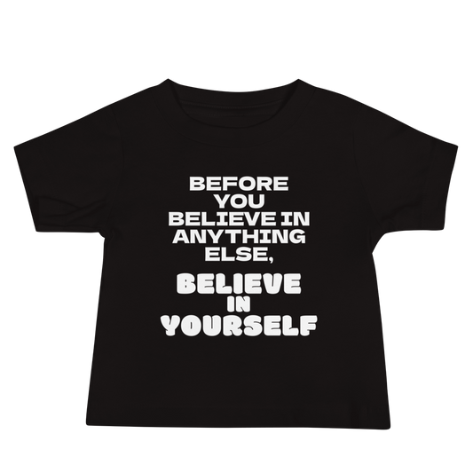 "Before you believe in anything else, believe in yourself" printed on a black baby jersey short sleeve tee laying on a flat surface