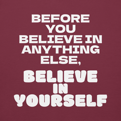 "Before you believe in anything else, believe in yourself" printed on a maroon background