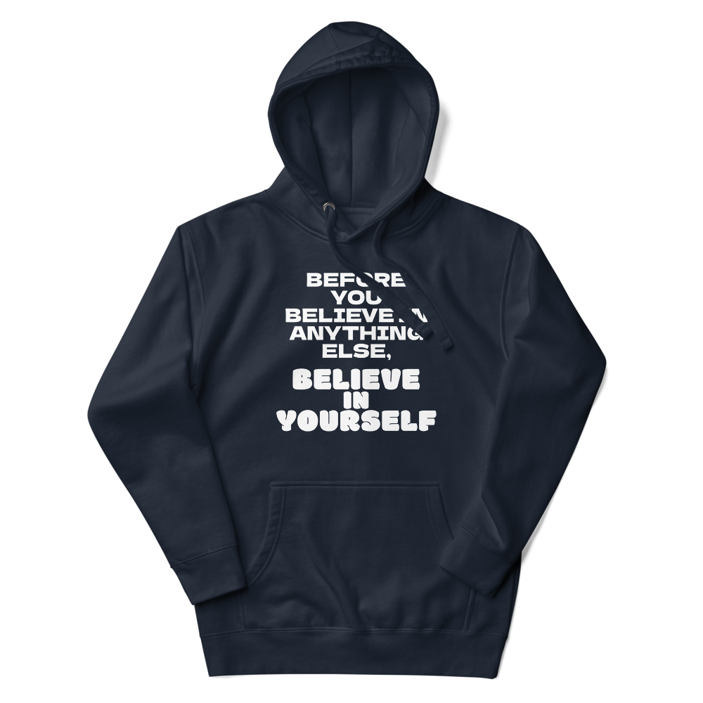"Before you believe in anything else, believe in yourself" printed on a navy blazer unisex hoodie laying on a flat surface with the hood up