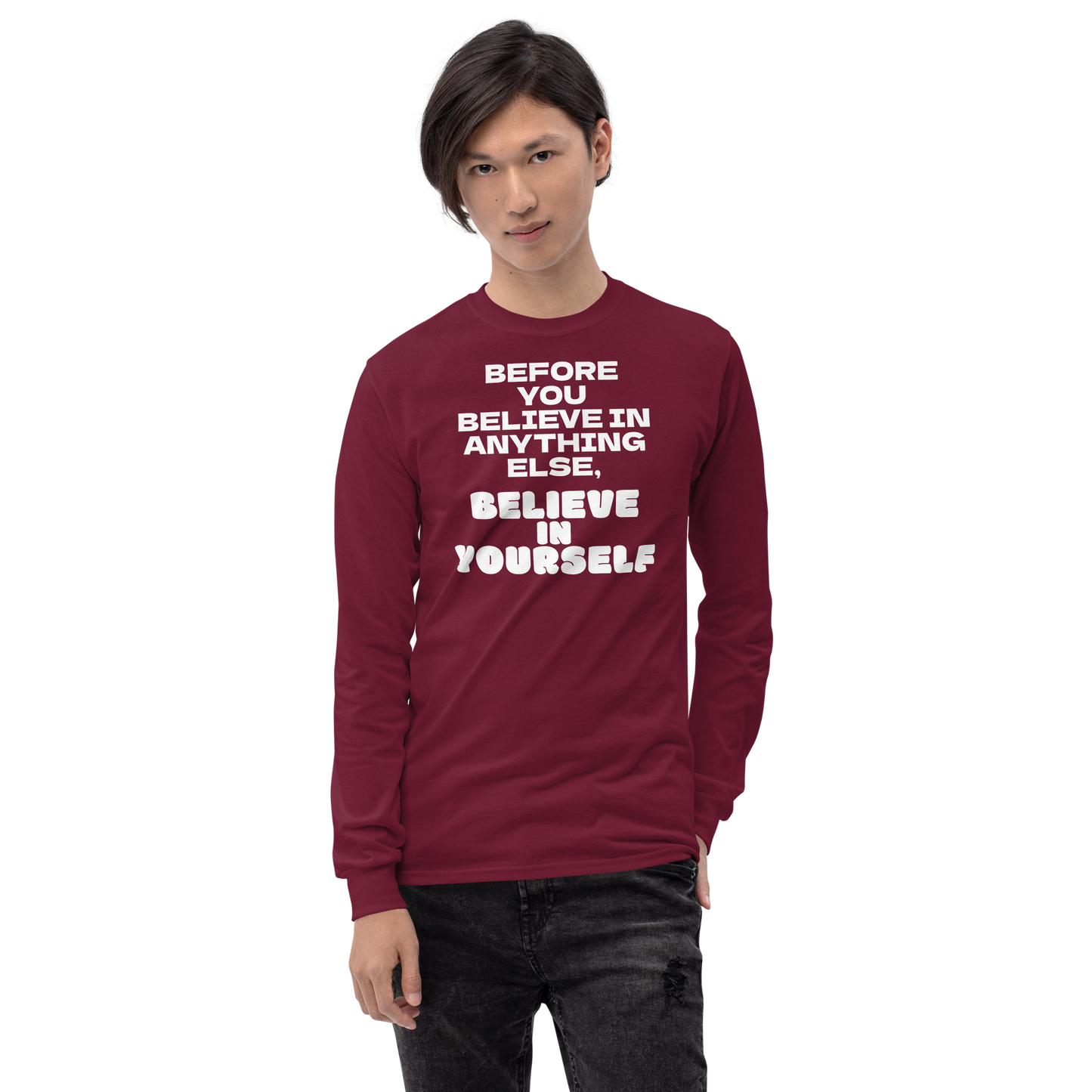"Before you believe in anything else, believe in yourself" printed on a maroon men's long sleeve shirt worn by a male