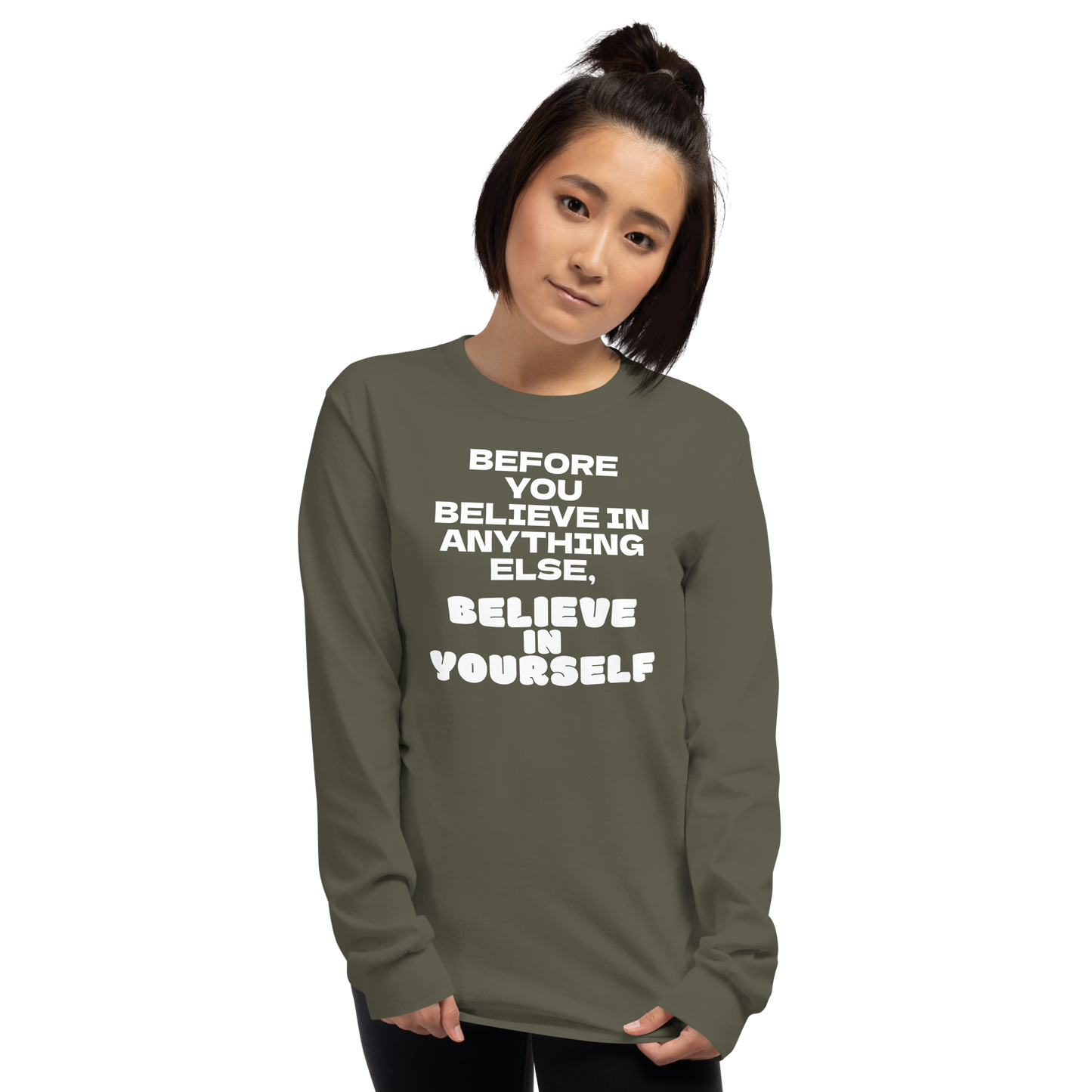 "Before you believe in anything else, believe in yourself" printed on a military green men's long sleeve shirt worn by a female