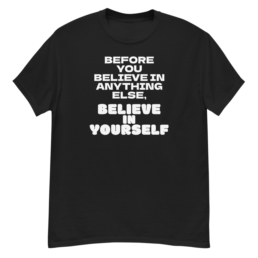 "Before you believe in anything else, believe in yourself" printed on a black unisex classic tee laying on a flat surface