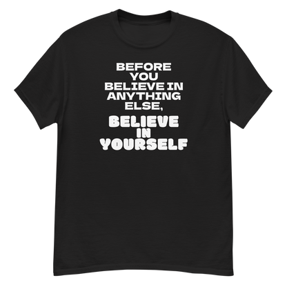 "Before you believe in anything else, believe in yourself" printed on a black unisex classic tee laying on a flat surface