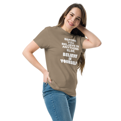 "Before you believe in anything else, believe in yourself" printed on a brown savana unisex classic tee worn by a female