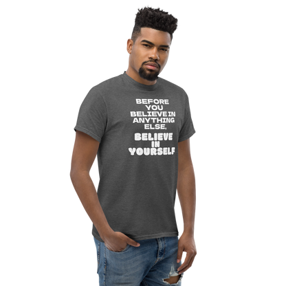 "Before you believe in anything else, believe in yourself" printed on a dark heather unisex classic tee worn by a male