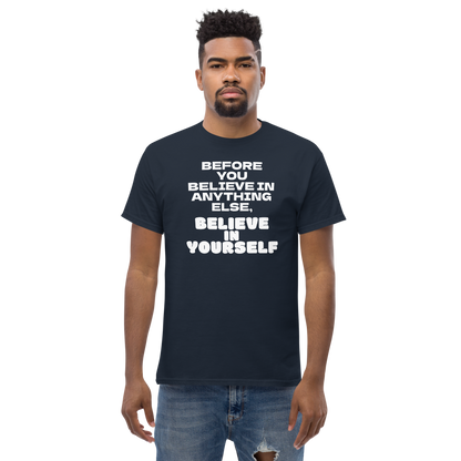 "Before you believe in anything else, believe in yourself" printed on a navy unisex classic tee worn by a male