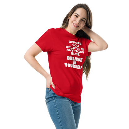 "Before you believe in anything else, believe in yourself" printed on a red unisex classic tee worn by a female
