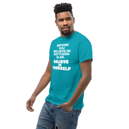 "Before you believe in anything else, believe in yourself" printed on a tropical blue unisex classic tee worn by a male