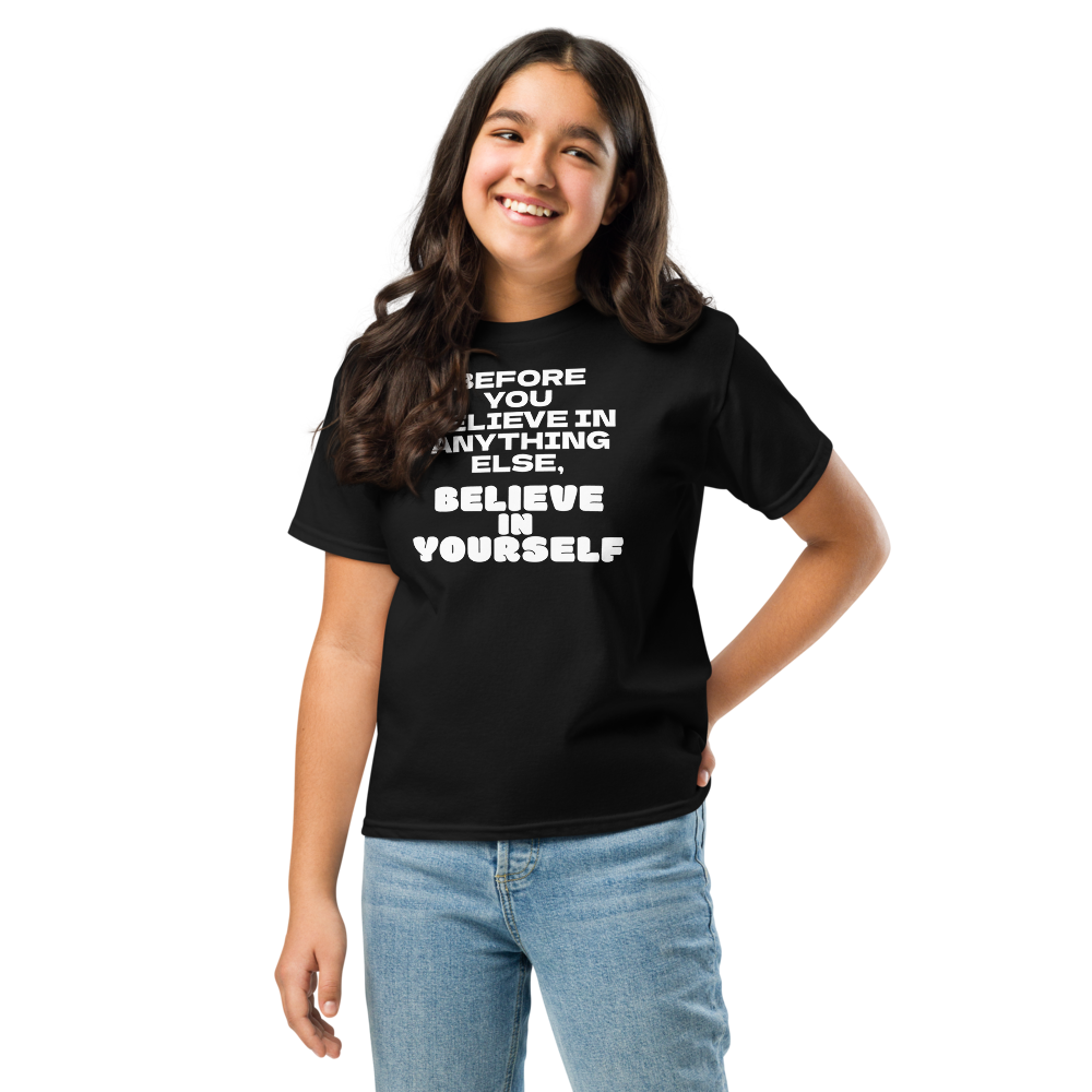 "Before you believe in anything else, believe in yourself" printed on a black youth classic tee worn by a female