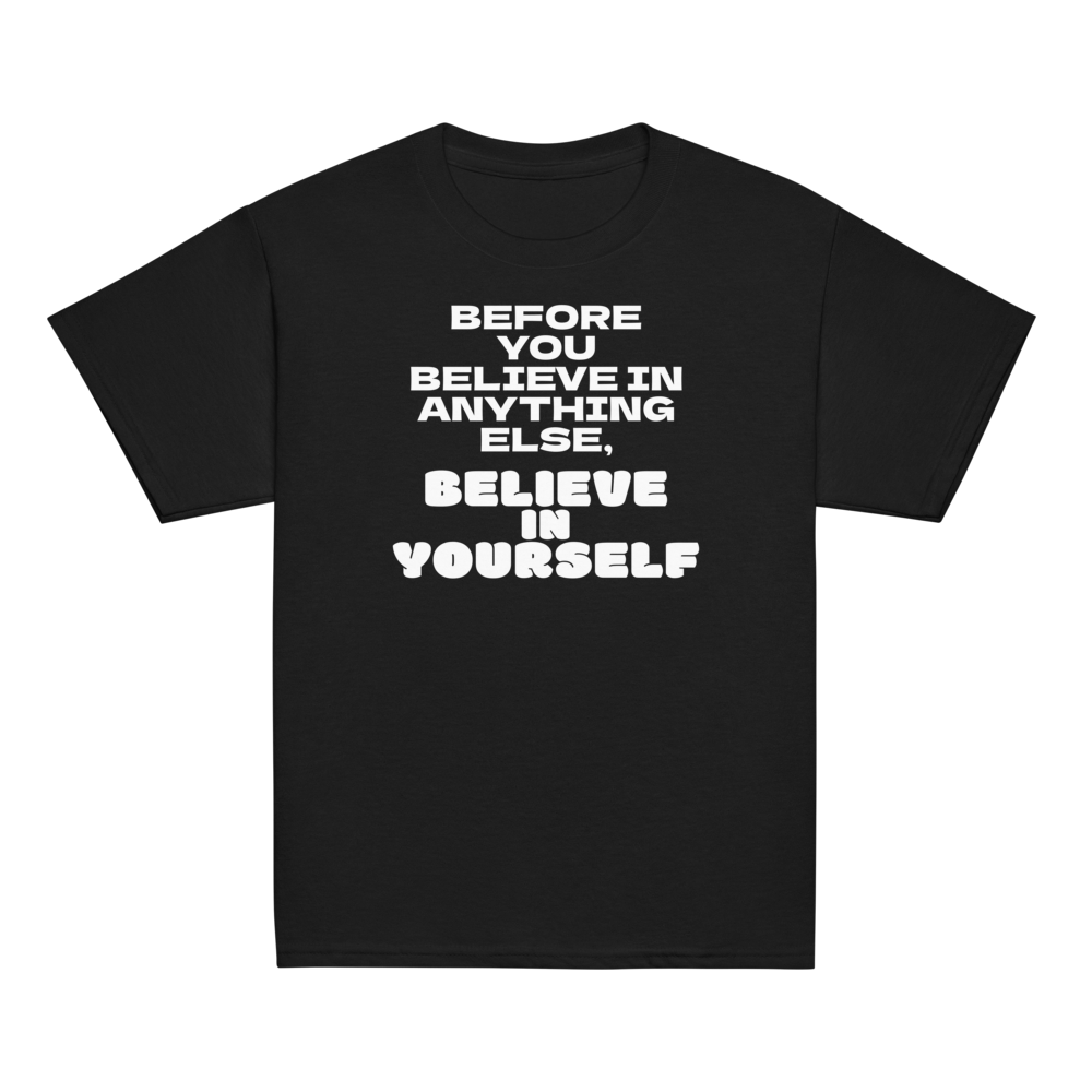 "Before you believe in anything else, believe in yourself" printed on a black youth classic tee laying on a flat surface