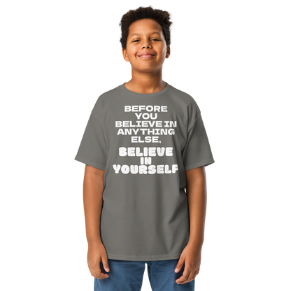 "Before you believe in anything else, believe in yourself" printed on a charcoal youth classic tee worn by a male