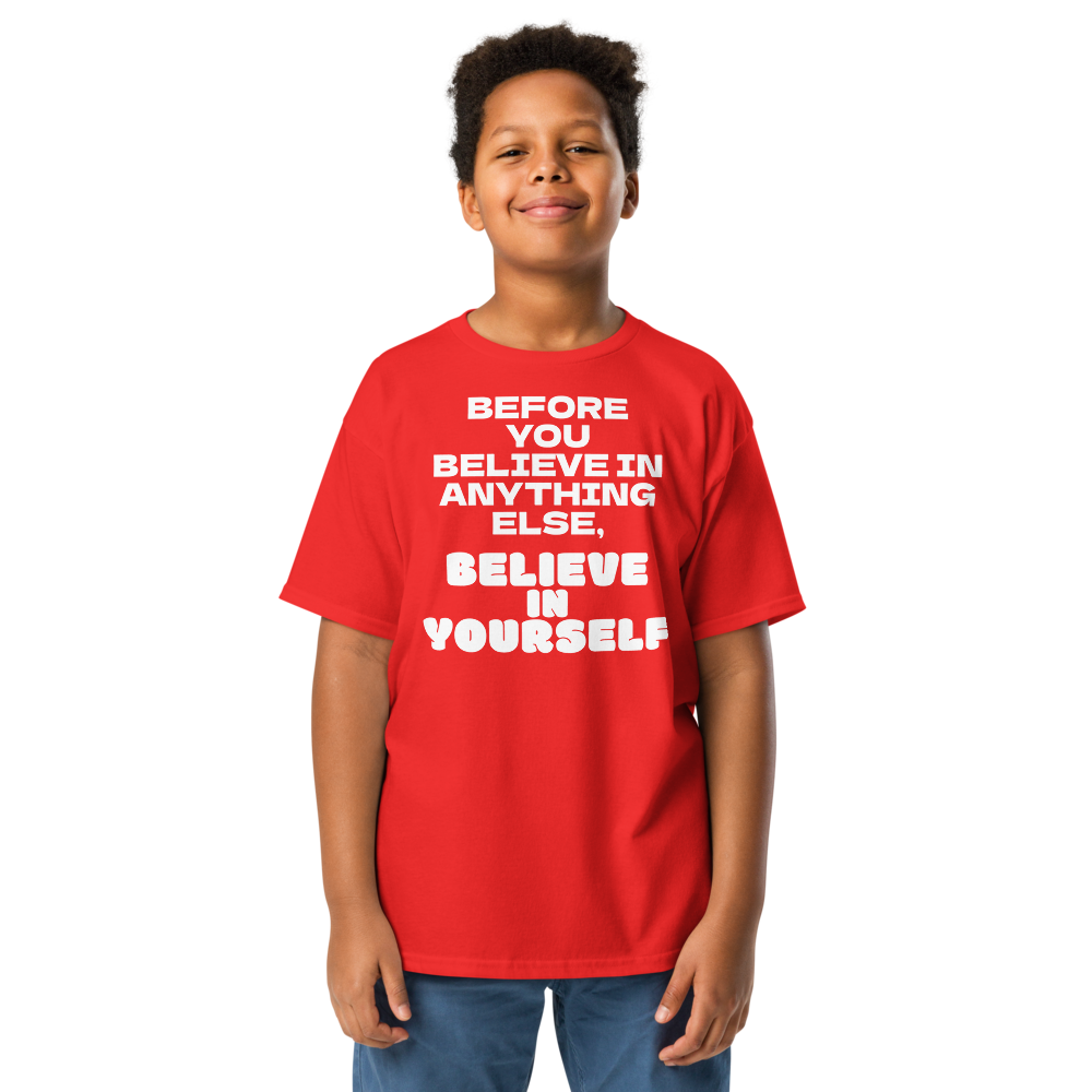"Before you believe in anything else, believe in yourself" printed on a red youth classic tee worn by a male