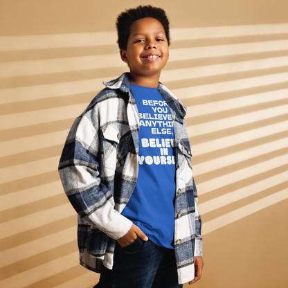 "Before you believe in anything else, believe in yourself" printed on a royal youth classic tee worn by a male also wearing a jacket