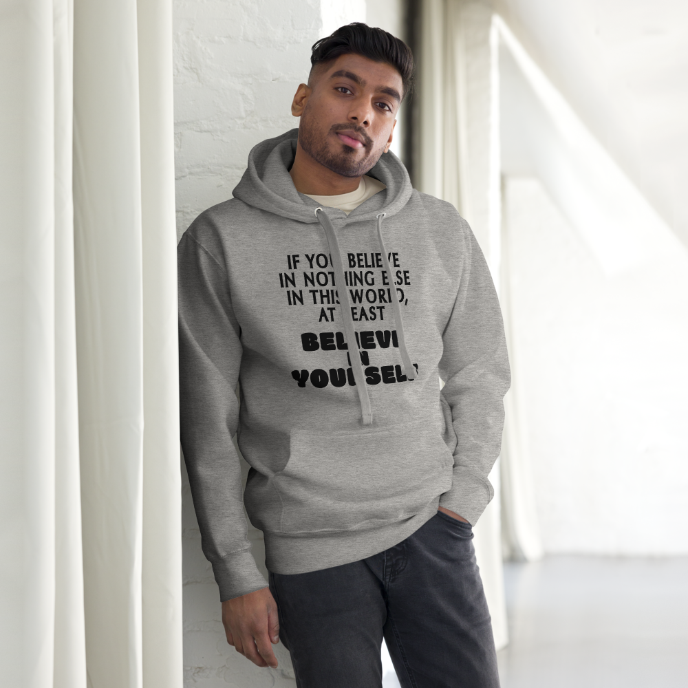 "If you believe in nothing else in this world, at least believe in yourself" printed on a carbon grey unisex hoodie worn by a male