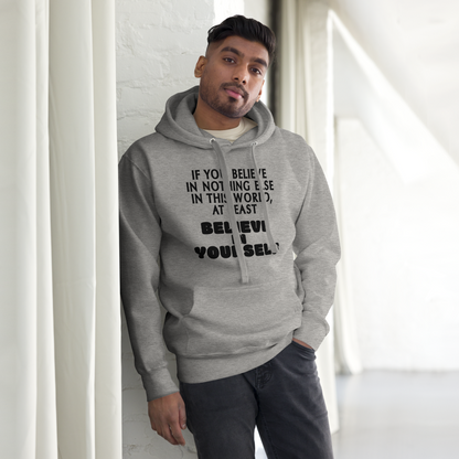 "If you believe in nothing else in this world, at least believe in yourself" printed on a carbon grey unisex hoodie worn by a male