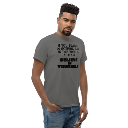 "If you believe in nothing else in this world, at least believe in yourself" printed on a charcoal unisex classic tee worn by a male