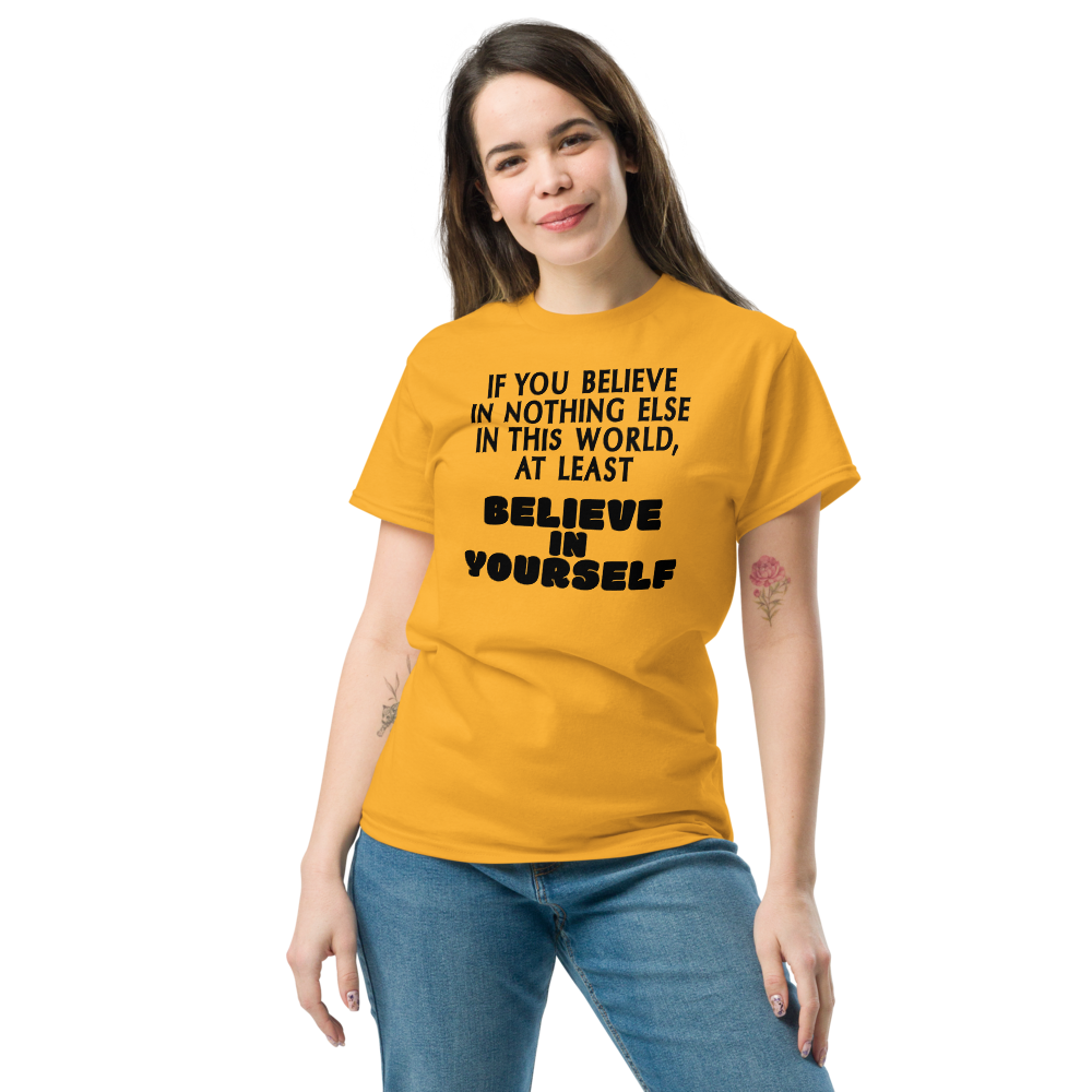"If you believe in nothing else in this world, at least believe in yourself" printed on a gold unisex classic tee worn by a female