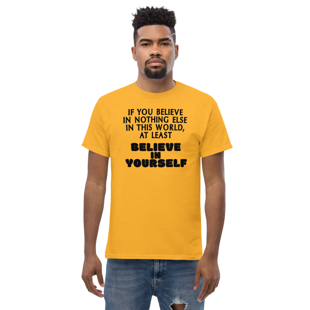 "If you believe in nothing else in this world, at least believe in yourself" printed on a gold unisex classic tee worn by a male