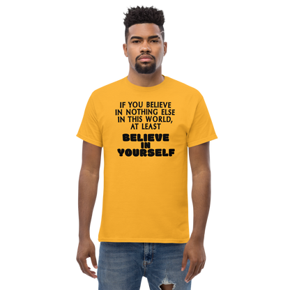 "If you believe in nothing else in this world, at least believe in yourself" printed on a gold unisex classic tee worn by a male