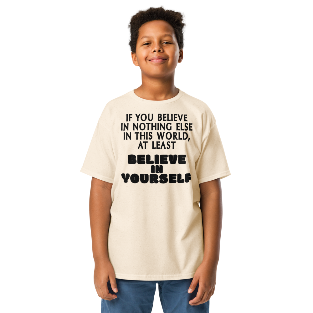 "If you believe in nothing else in this world, at least believe in yourself" printed on a natural youth classic tee worn by a male