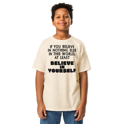 "If you believe in nothing else in this world, at least believe in yourself" printed on a natural youth classic tee worn by a male